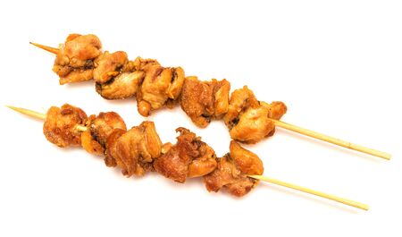 Skewers of chicken on white backgroundの写真素材