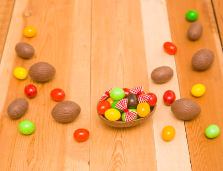 Easter chocolate eggs on a wooden backgroundの写真素材
