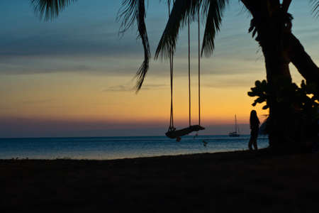 Silhouette on the bungee over the seaの写真素材