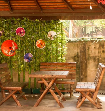 Table and chair with bamboo and umbrella background ,that public sources の写真素材