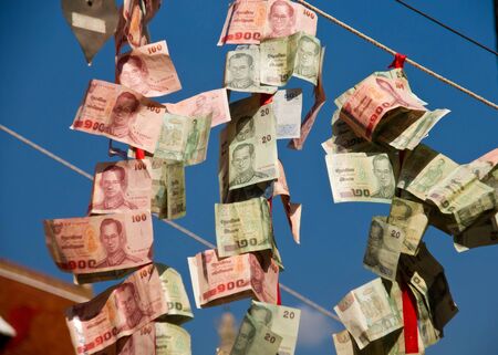 Thai money  hanging on a rope.の写真素材