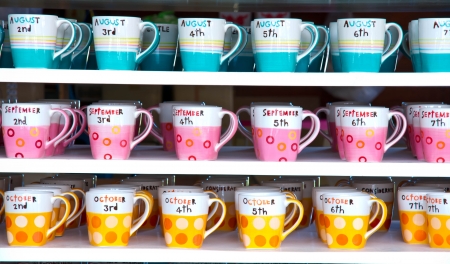 Colorful coffee cup on the floor ,blue, pink and orange.の写真素材