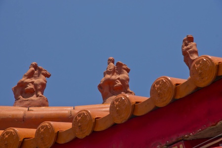 closed up Chinese temple roof with blue sky background