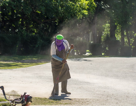 Men face off was sweeping a cloud of dust behind.