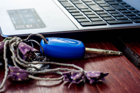 Blue key and keyboard note bookの写真素材