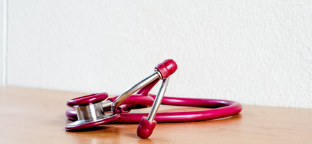 Closed up red  stethoscope Put on the tableの写真素材
