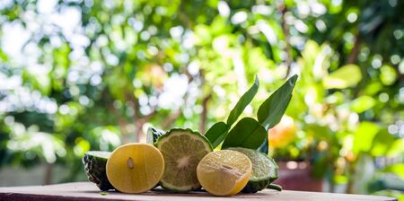 fresh bergamot and lemon fruit on wooden table background ,Bokeh background
