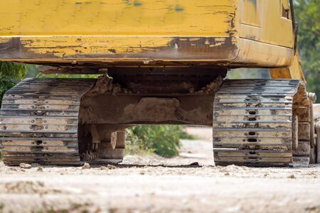 The wheel of a backhoe. Dirty wheel of a backhoe. in the construction siteの写真素材