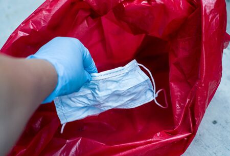 Biological risk waste disposed of in the red trash bag in hospital ,surgical maskの写真素材