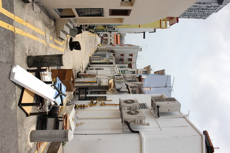 Waste junk in back alleyの写真素材