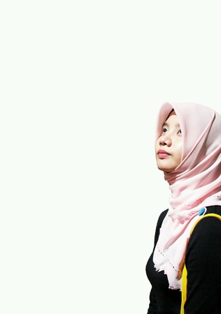 Beautiful muslim girl looking up の素材