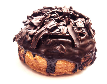 The doughut full of topping with chocolate isolated