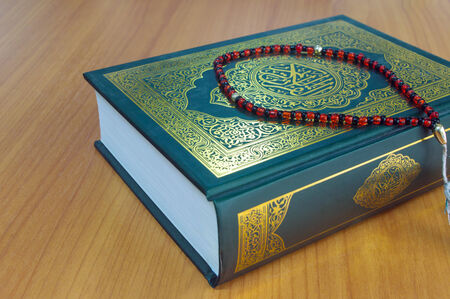quran on the wooden table backgroundの写真素材