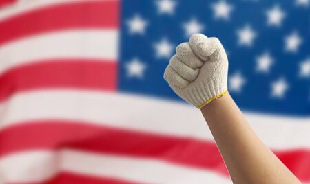 Labor hand on the USA Flag backgroundの写真素材