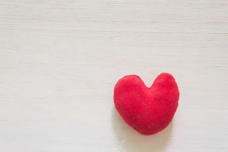 heart lay on vintage white wood backgroundの写真素材