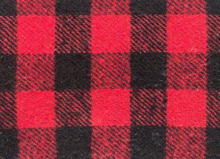 Red and black wool plaid print as background.Scottish tartan pattern.の写真素材