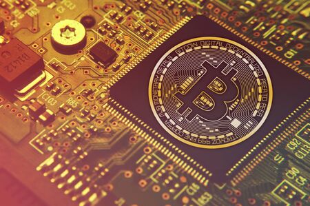 Bitcoin concept - Printed circuit board with bitcoin processor and microchips illustrationの写真素材