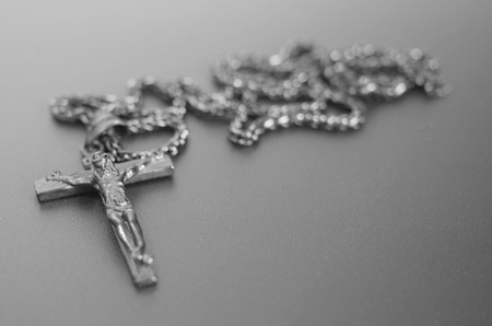 crucifixion from a tree Jesus's gilt figure black and white image with copyspace for textの写真素材