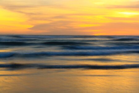 Slow speed sea wave at sunset time, Parangtritis Beach, Jogjakarta, Indonesiaの写真素材