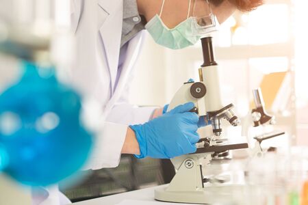 An Asian male scientist is experimenting with the search for medicine. In the lab