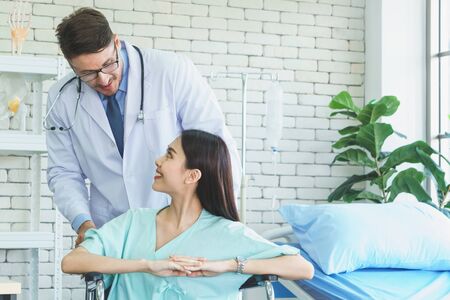 Photos of a male doctor taking care of a female patient and providing health care advice In the...
