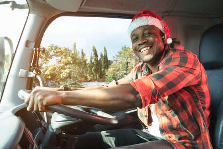 Smile Confidence truck driver wear Santa Clause hat driving semi-truck In Business Long transport....