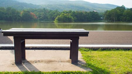 Chair and lake in sunny day