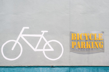 Bicycle symbol on bicycle parking in the wallの写真素材