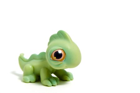 cute green dinosaur with big eyes, isolated on whiteの写真素材