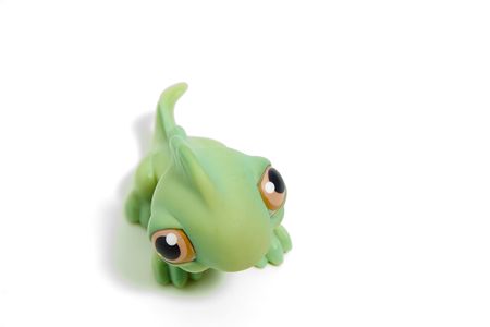 cute green dinosaur with big eyes, isolated on whiteの写真素材