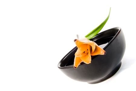 beautiful lily flower on a bowl of waterの写真素材