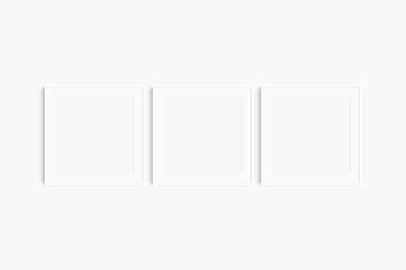 Frame mockup 1:1 square. Set of three thin white square frames. Clean, modern, minimalist, bright gallery wall mockup, set of 3 frames with a mat opening.の写真素材