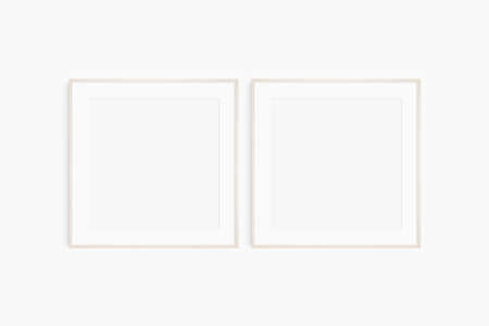 Frame mockup 1:1 square. Set of two thin light wood frames. Clean, modern, minimalist, bright gallery wall mockup, set of 2 square frames with a mat opening.の写真素材