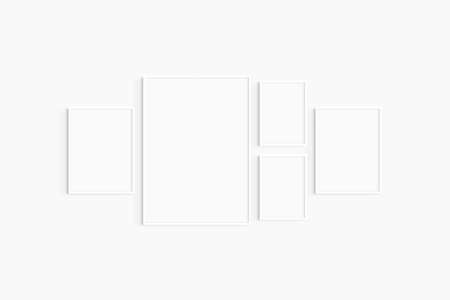Gallery wall mockup. Set of 5 white frames. Gallery wall frame mockup. One 50x70 (5:7), two 30x40 (3:4), and two A4 (5:7) white frames.の写真素材
