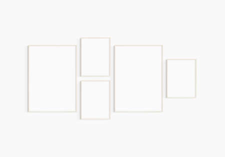 Gallery wall mockup. Set of 5 light wood frames. Gallery wall frame mockup. Two 50x70 (5:7) and three 30x40 (3:4) wooden frames.の写真素材