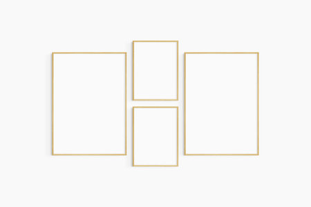 Gallery wall mockup. Set of 4 oak wood frames. Gallery wall frame mockup. Two 50x70 (5:7) and two 30x40 (3:4) wooden frames.の写真素材