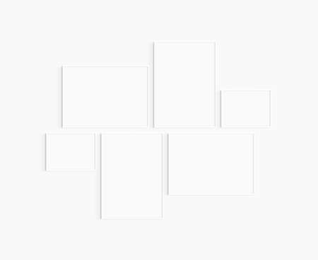 Gallery wall mockup. Set of 6 white frames. Gallery wall frame mockup. Two 50x70 (5:7), two 70x50 (7:5), and two 40x30 (4:3) white frames.の写真素材
