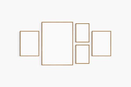 Gallery wall mockup. Set of 5 cherry wood frames. Gallery wall frame mockup. One 50x70 (5:7), two 30x40 (3:4), and two A4 (5:7) wooden frames.の写真素材