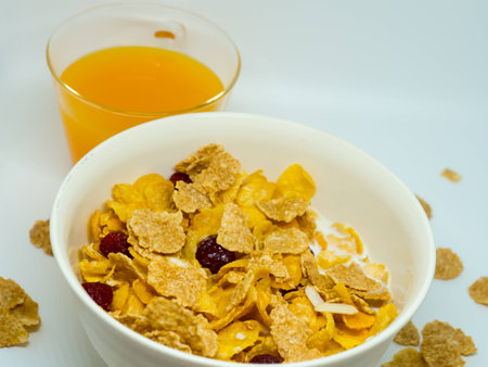 The breakfast cereal topped with dried fruit.