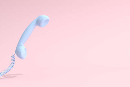 Mock up of blue telephone on pink background. 3D rendering.の写真素材
