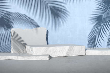 3D rendering of white stone podium for product presentation on blue concrete wall with palm leaf shadow.の写真素材