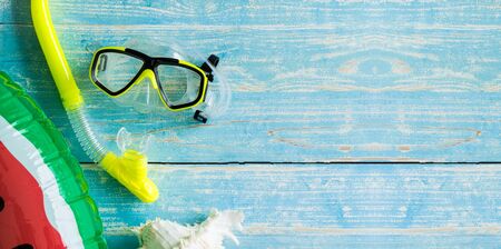 Dive accessories on vintage wooden background. Top view with copy space.の写真素材