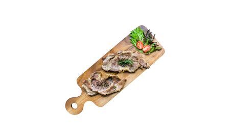 Top view Grilled beef steak on wooden cutting board isolated on white backgroundの写真素材
