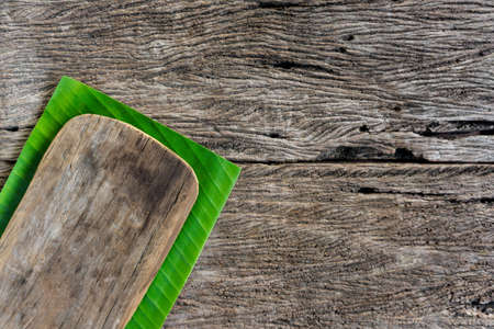 Cutting board on banana leaf. Top view with copy spaceの写真素材