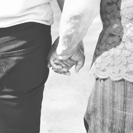 Hand in hand: hold old people's hand to across the streetの写真素材