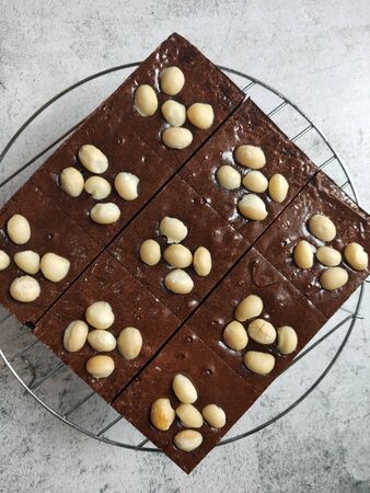 Macadamia Brownies are divided into pieces ready to serve.の写真素材