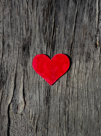 beautiful red heart lies on a old wooden background Valentine's day conceptの写真素材