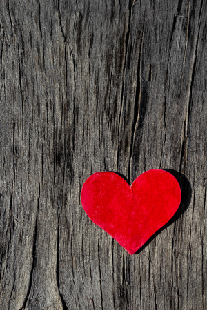 beautiful red heart lies on a old wooden background Valentine's day conceptの写真素材