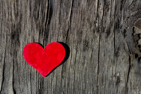 red heart lies on a old rotten wooden background Valentine's day conceptの写真素材