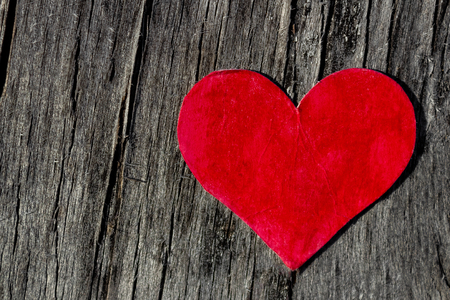 Valentine's day red heart on old woodの写真素材